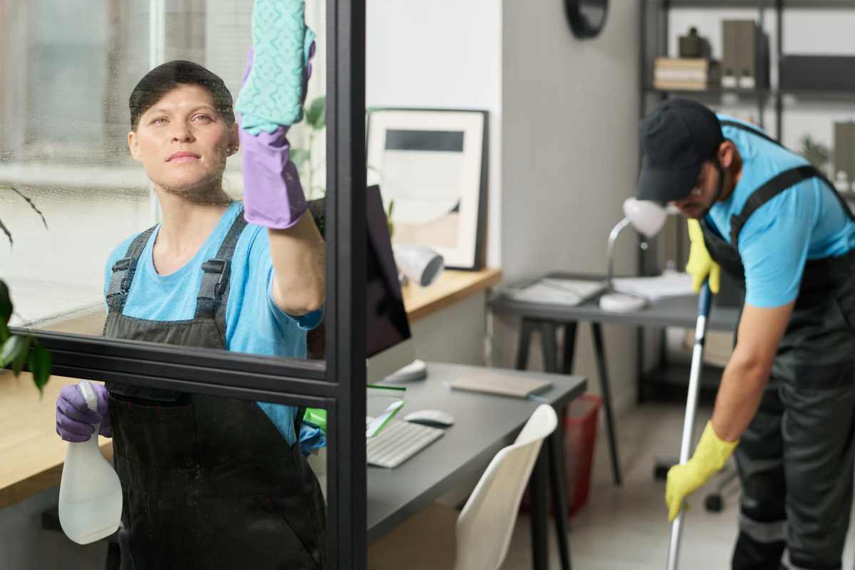 Cleaning workers cleaning office windows