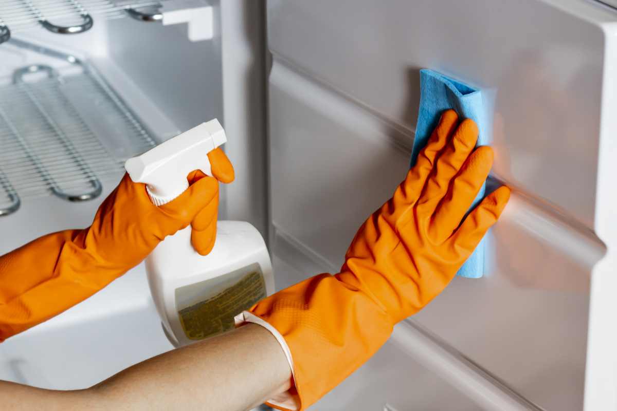Refrigerator cleaning with protective gloves