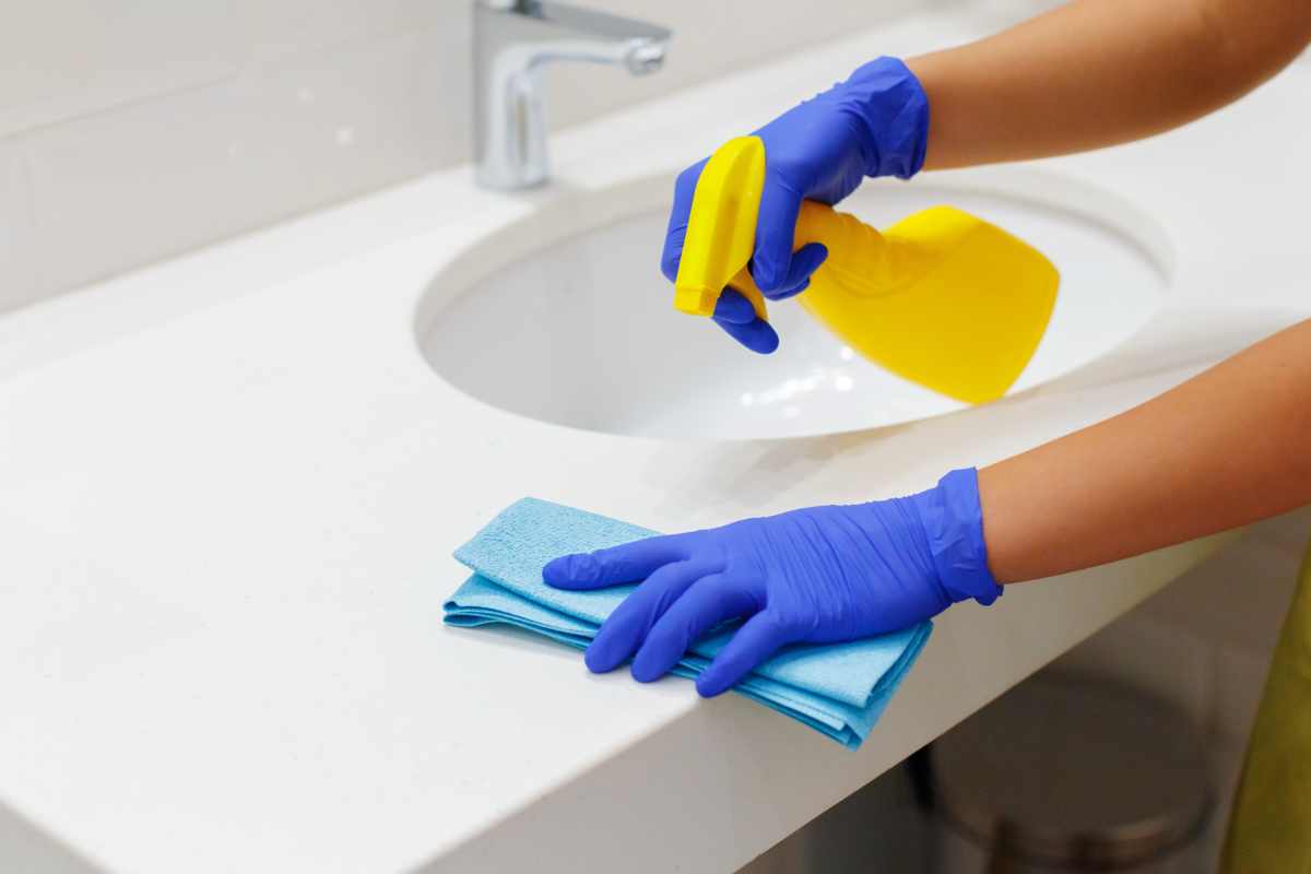Restroom cleaning in action by professional cleaner