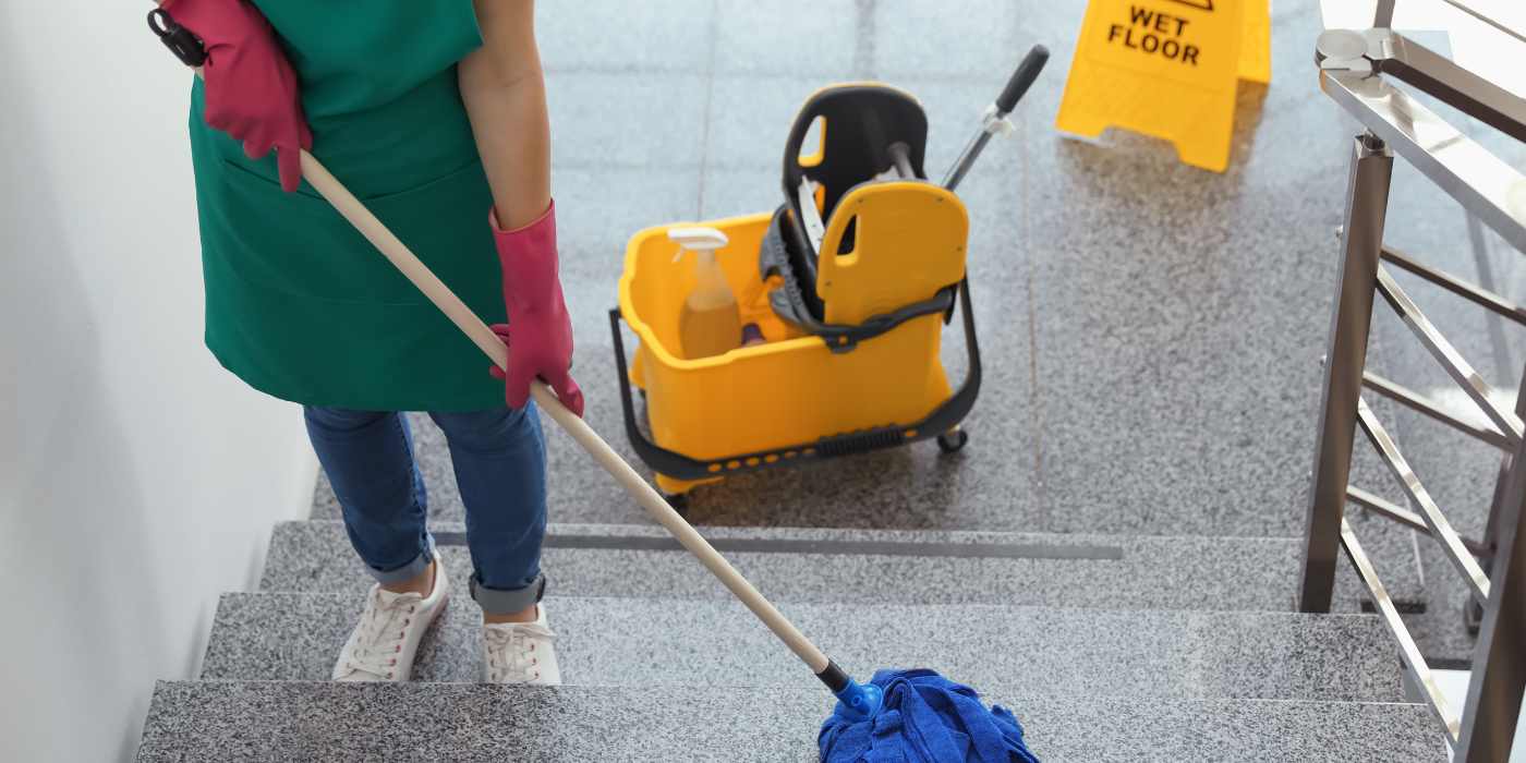 Cleaner mopping stairs for floor cleaning service
