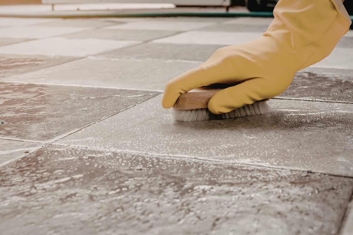 Deep cleaning grout on tiled floor
